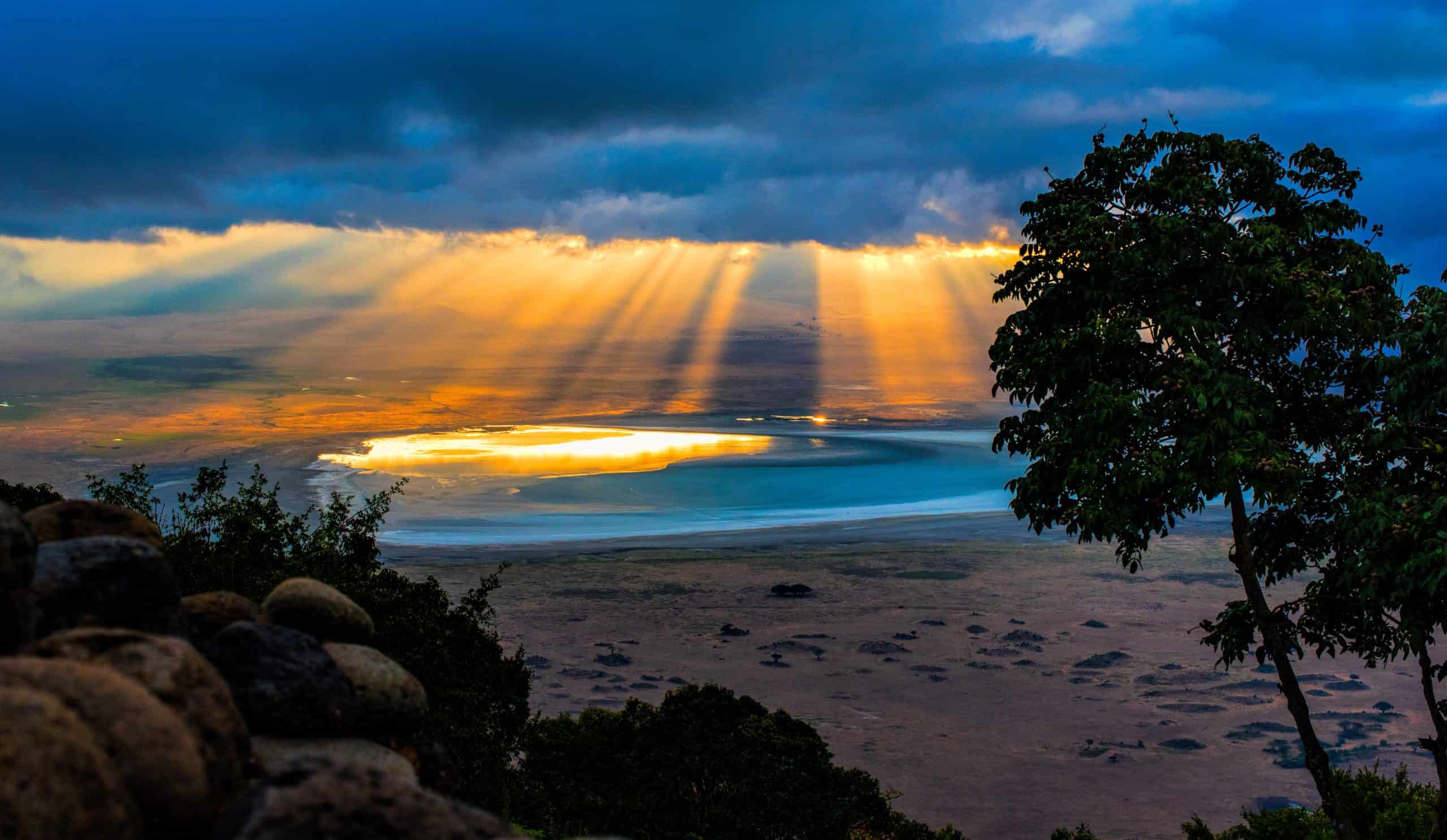 Sun,rays,peeping,through,the,clouds,at,sunrise,in,ngorongoro